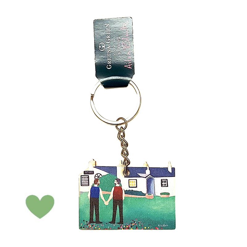 Nyckelring i trä utskuren